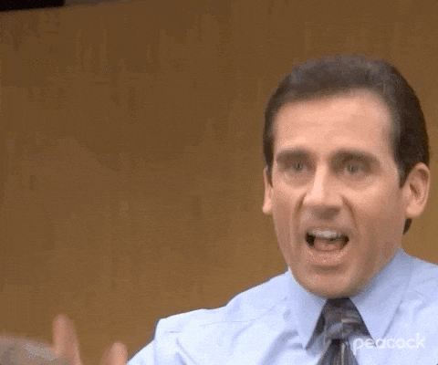 Michael Scott from The Office shouting and gesturing